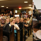 From L to R: Rep. Yvette Clarke, D-NY gets a warm welcome; Rep. Mark Amodei, R-Nev., responds to a woman who questioned why he doesn’t hold more public town hall meetings when he’s back home; Rep. Frank Lucas, R-Oklahoma, gestures. Images via AP.